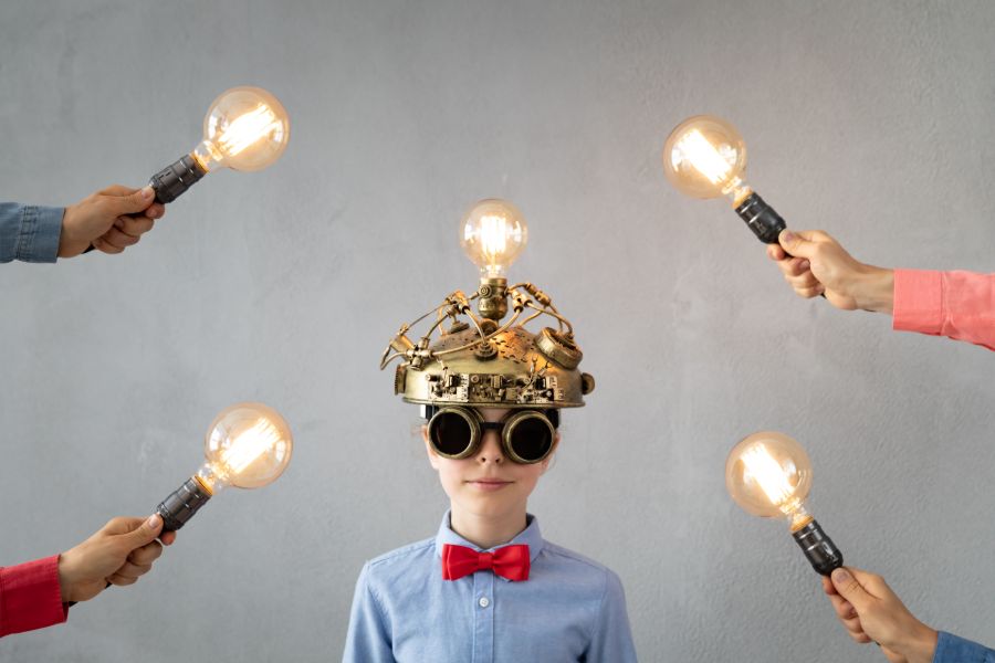 Photo Of A Boy With Light Bulbs All Around His Head.