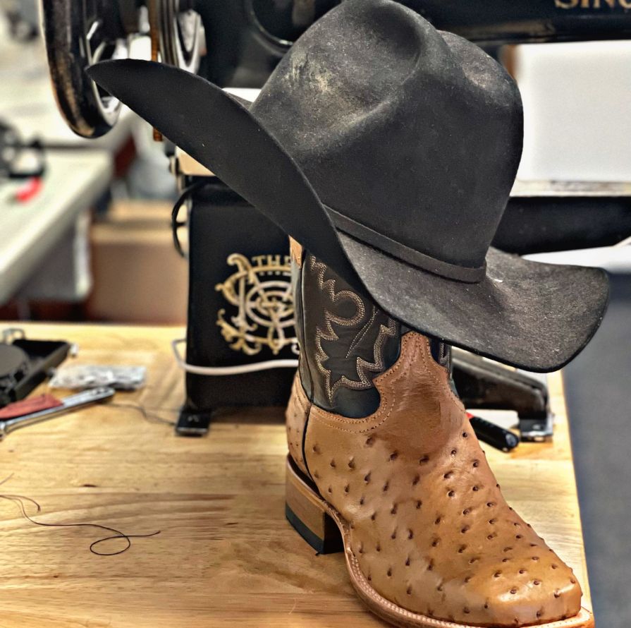 A Cowboy Hat And Boot.