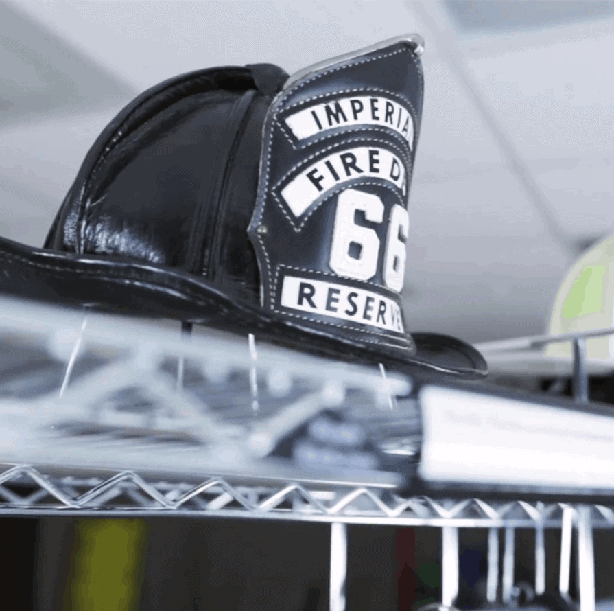 Black Firefighter Helmet On A Rack