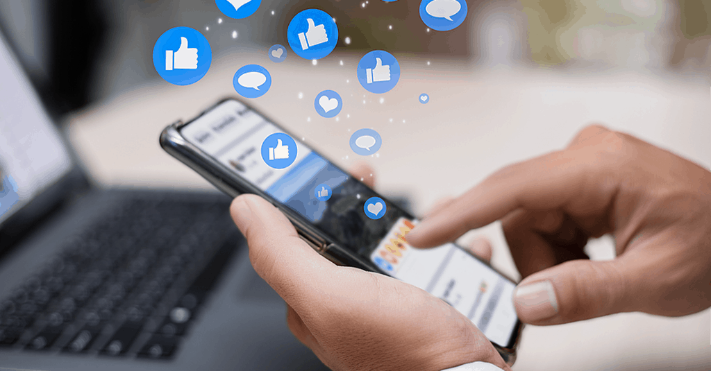 Man Scrolling Through Social Media On His Phone