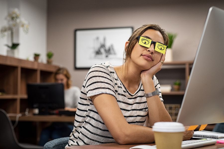 Someone Sleeping On The Job, Pretending To Be Awake And Aware With Eyes Drawn On Post-It Notes On Their Glasses.
