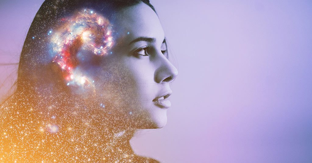 Woman with galaxy by her head.